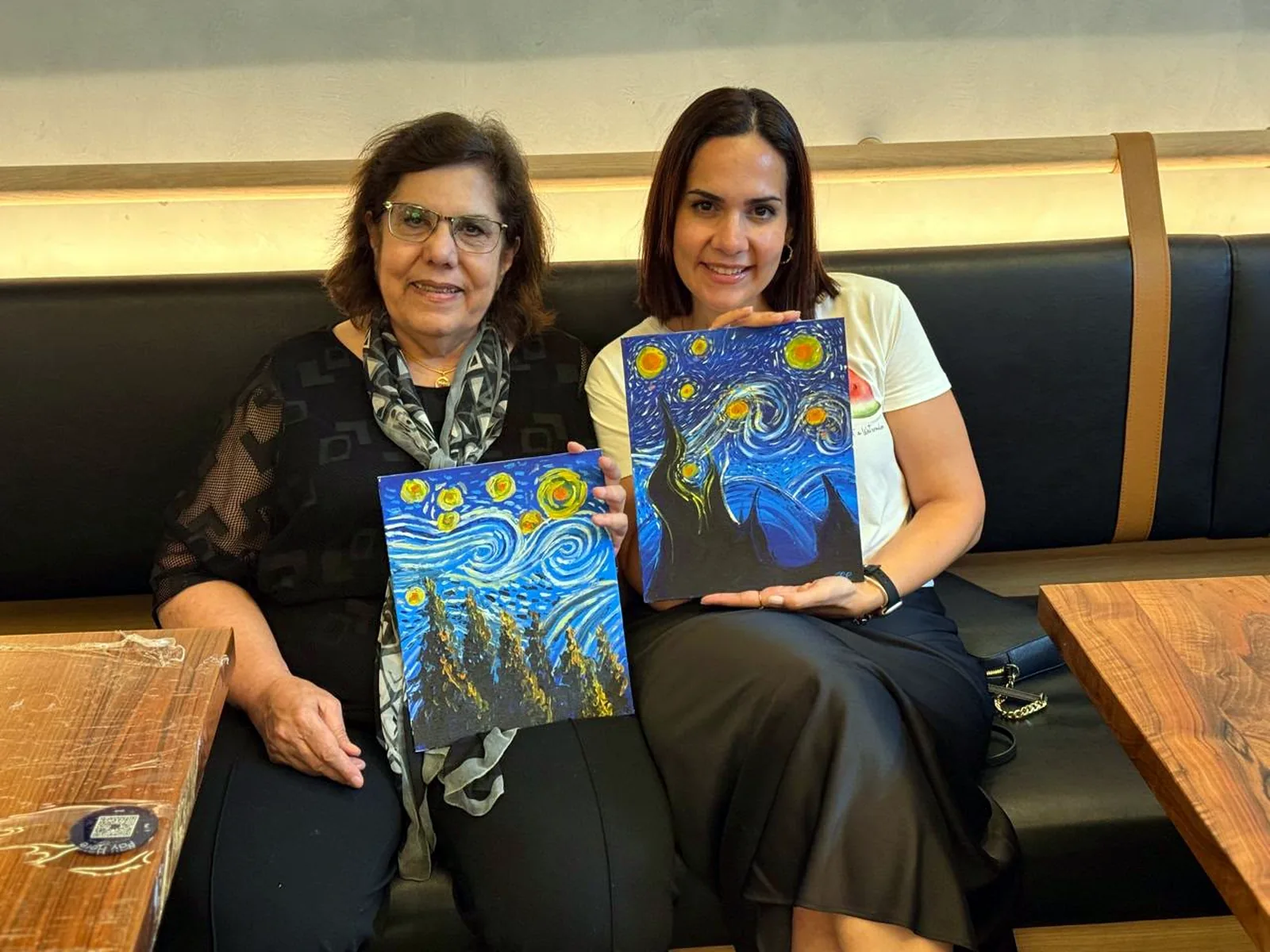 Guests enjoying a CANVAS Starry Night painting session in a Dubai café